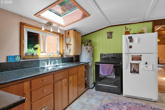 91625 W Fork Rd, Deadwood, OR 97430 - kitchen featuring freestanding refrigerator, black range with electric cooktop, a skylight, vaulted ceiling, and light tile patterned flooring