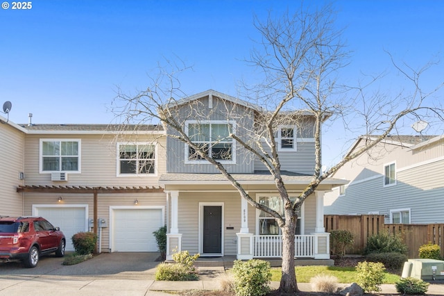 view of front of house featuring a garage and a porch