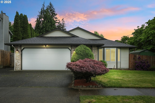12705 NE 101st St, Vancouver, WA 98682 - ranch-style house featuring a garage, asphalt driveway, brick siding, and roof with shingles