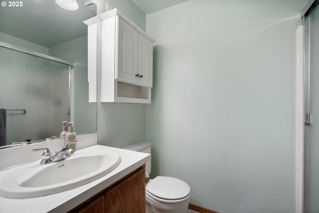 12705 NE 101st St, Vancouver, WA 98682 - bathroom with toilet, vanity, an enclosed shower, and baseboards