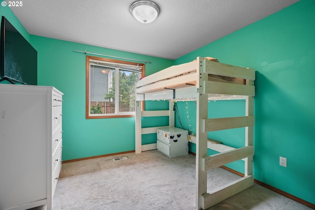 12705 NE 101st St, Vancouver, WA 98682 - unfurnished bedroom featuring carpet floors, a textured ceiling, and baseboards