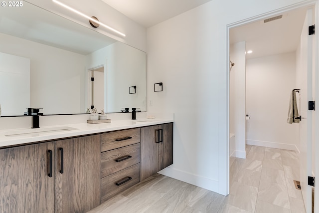 967 S 66th Pl, Springfield, OR 97478 - bathroom featuring double vanity, tub / shower combination, and marble finish flooring