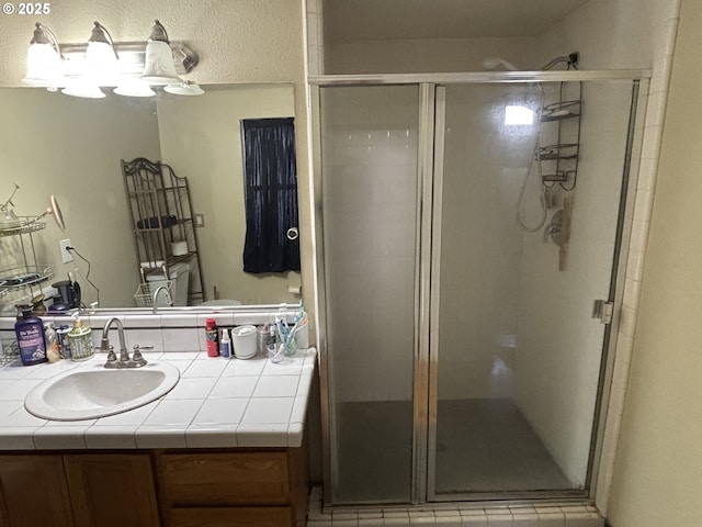 bathroom with vanity and walk in shower