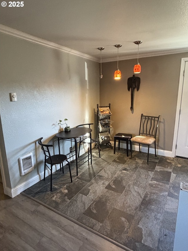 interior space featuring crown molding and heating unit