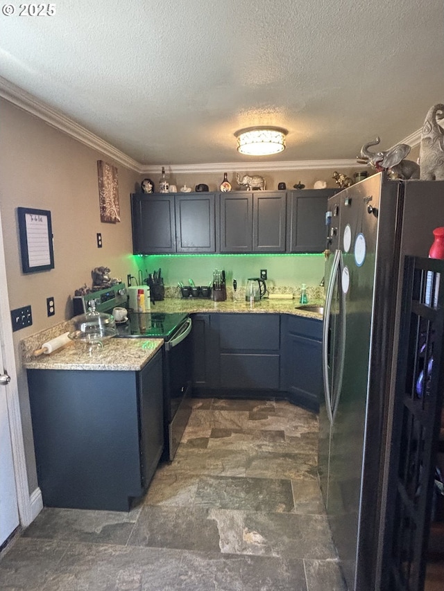 kitchen with crown molding, stainless steel appliances, light stone countertops, a textured ceiling, and kitchen peninsula