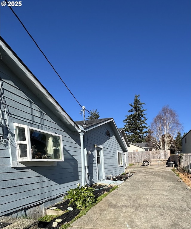 view of property exterior with a patio