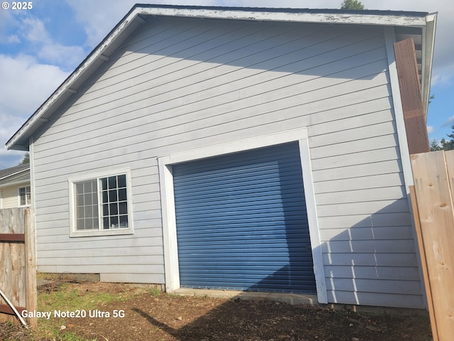 view of side of property featuring a garage