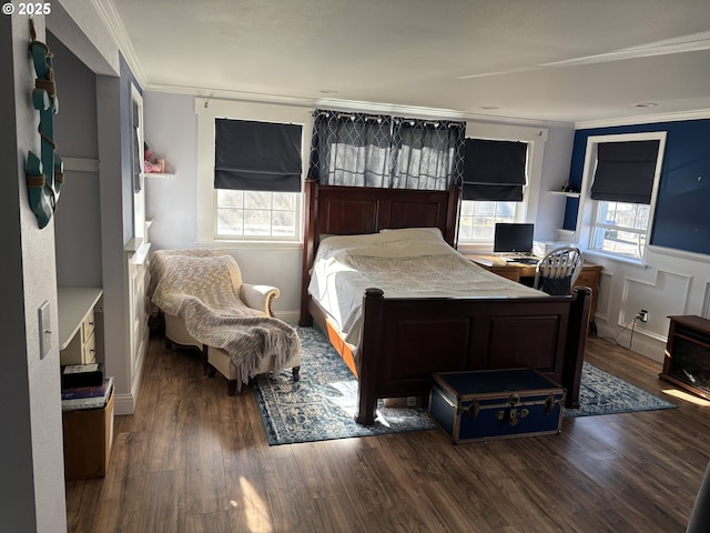 bedroom featuring ornamental molding and dark hardwood / wood-style floors