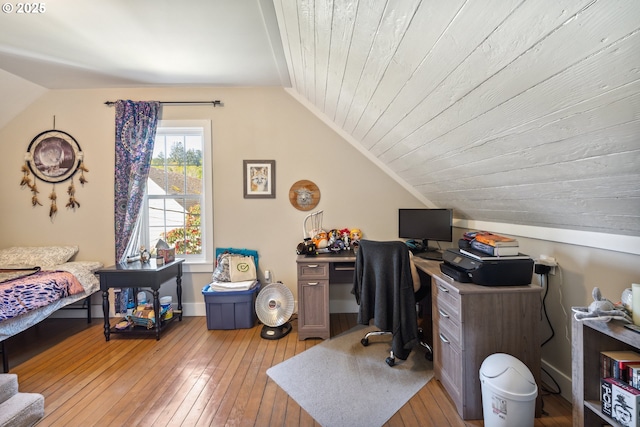 office area featuring vaulted ceiling and hardwood / wood-style flooring