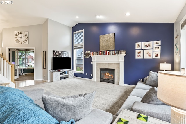 1393 NE 11th Ave, Canby, OR 97013 - carpeted living room with a tiled fireplace, high vaulted ceiling, and recessed lighting