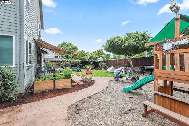 1393 NE 11th Ave, Canby, OR 97013 - fenced backyard featuring a playground and a garden