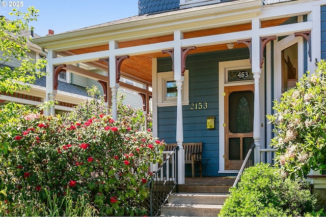 entrance to property featuring a porch
