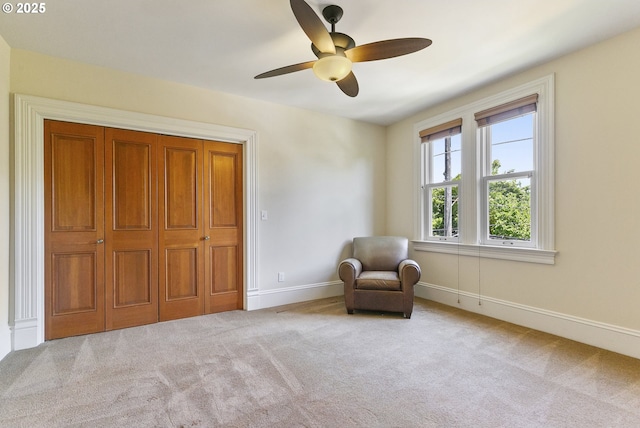 unfurnished room with carpet, ceiling fan, and baseboards