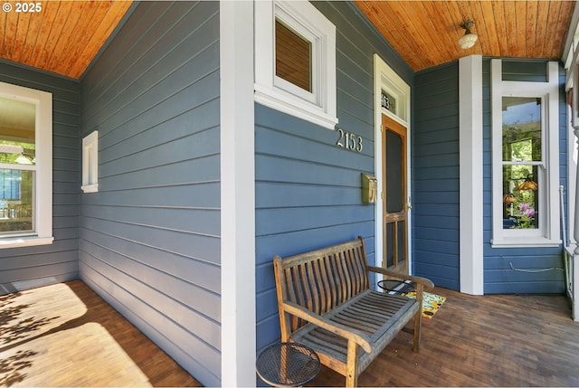 view of exterior entry with covered porch
