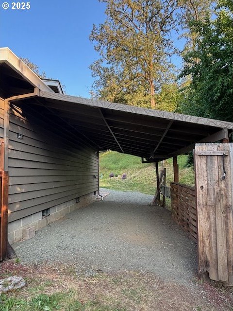 610 SE Maple St, Oakland, OR 97462 - view of parking featuring a carport