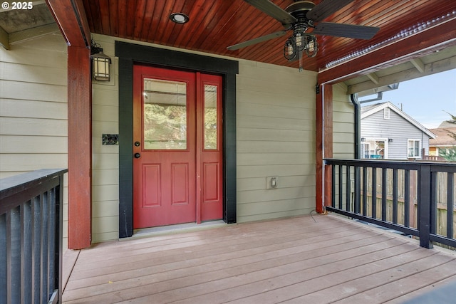 doorway to property with a porch and ceiling fan