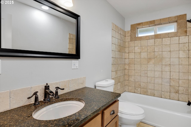 full bath featuring shower / bathtub combination, toilet, and vanity