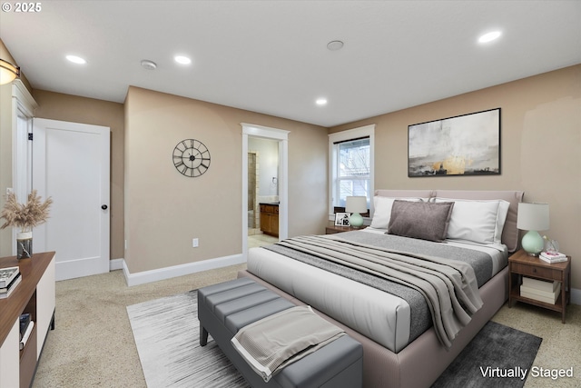 bedroom with light carpet, recessed lighting, connected bathroom, and baseboards