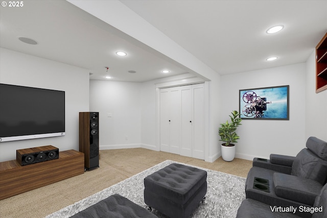 living room featuring recessed lighting, baseboards, and carpet floors