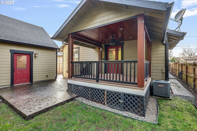 rear view of property featuring a patio, cooling unit, fence, and ceiling fan