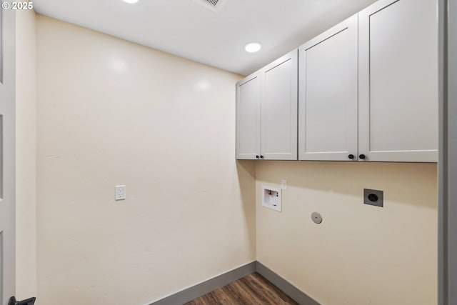 washroom featuring cabinets, electric dryer hookup, dark hardwood / wood-style floors, and hookup for a washing machine