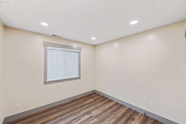 unfurnished room featuring dark hardwood / wood-style floors