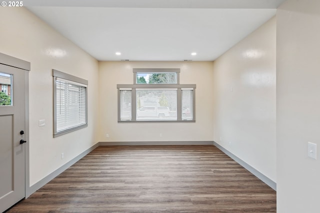 foyer entrance featuring dark hardwood / wood-style floors