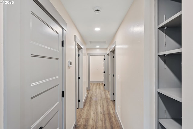 corridor featuring light hardwood / wood-style floors