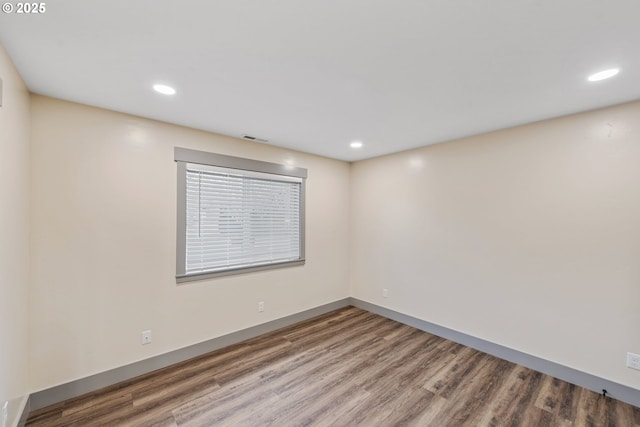 unfurnished room featuring hardwood / wood-style floors