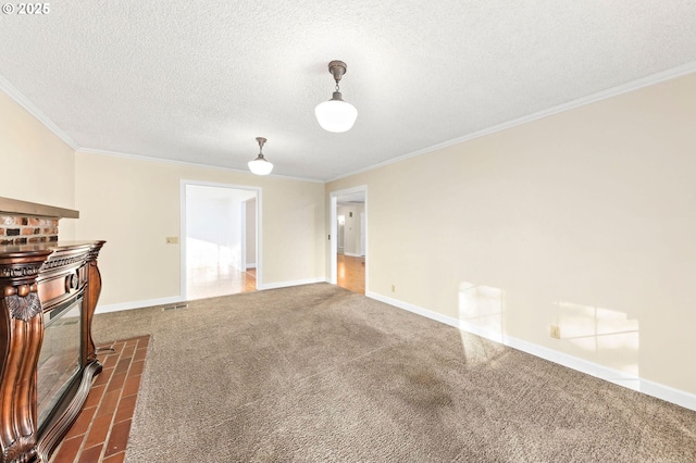 unfurnished living room with a textured ceiling, baseboards, carpet flooring, and crown molding