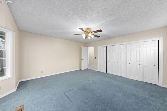 unfurnished bedroom with carpet, visible vents, ceiling fan, and baseboards