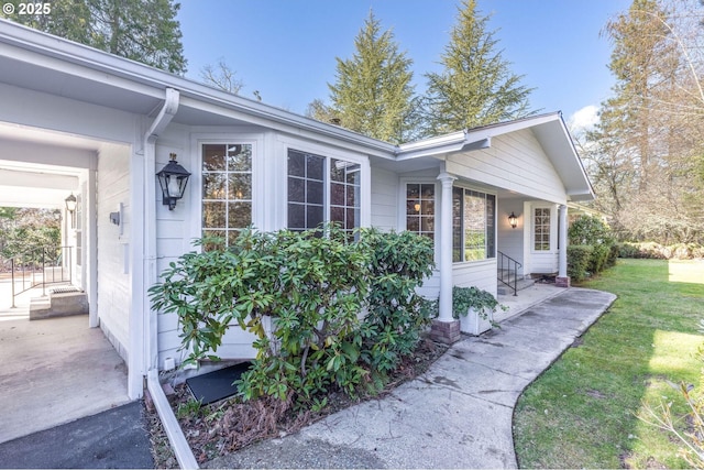 view of property exterior featuring a lawn