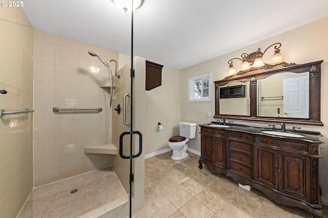 full bathroom with a stall shower, a sink, and toilet