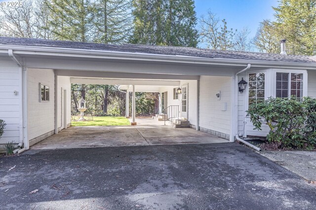 exterior space with a carport and driveway