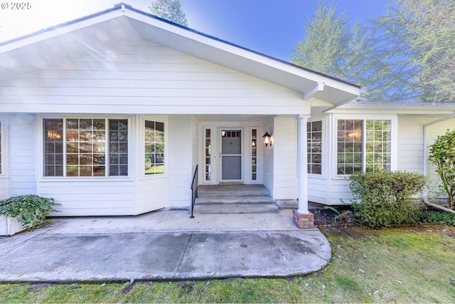 property entrance featuring covered porch