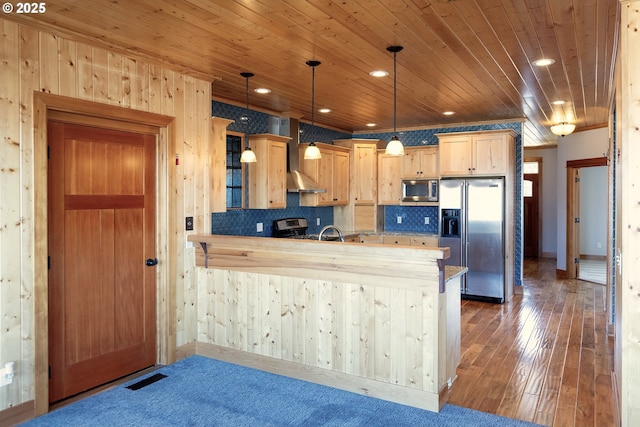 371 Summit Ridge Dr, The Dalles, OR 97058 - kitchen featuring appliances with stainless steel finishes, a peninsula, wooden ceiling, backsplash, and light brown cabinetry