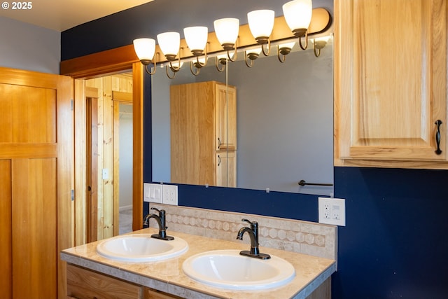 full bathroom featuring double vanity and a sink