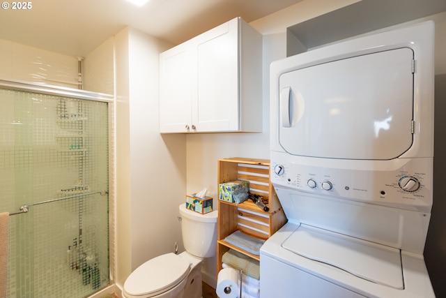 full bath featuring stacked washer and dryer, a shower stall, and toilet