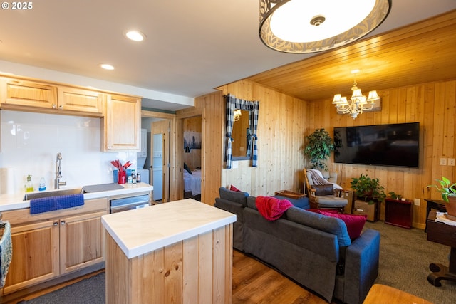 371 Summit Ridge Dr, The Dalles, OR 97058 - kitchen with a sink, open floor plan, wooden walls, tile counters, and light brown cabinetry