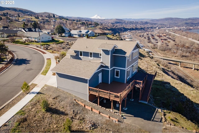 drone / aerial view with a residential view and a mountain view