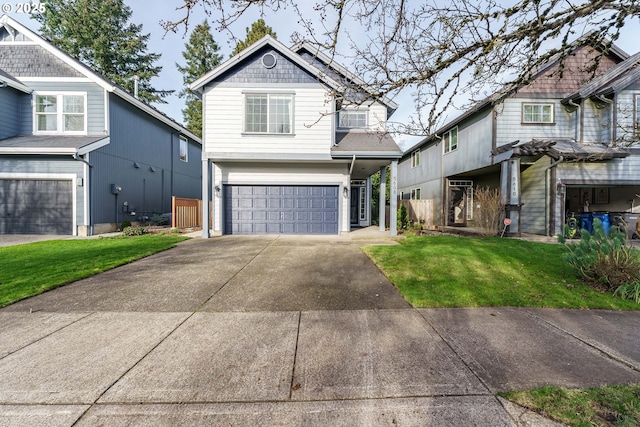 view of front of home featuring a front lawn and a garage