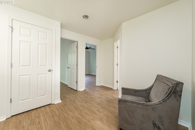 sitting room with light hardwood / wood-style floors