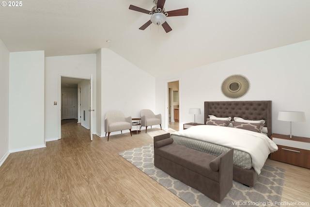 bedroom featuring ceiling fan, vaulted ceiling, and light wood-type flooring