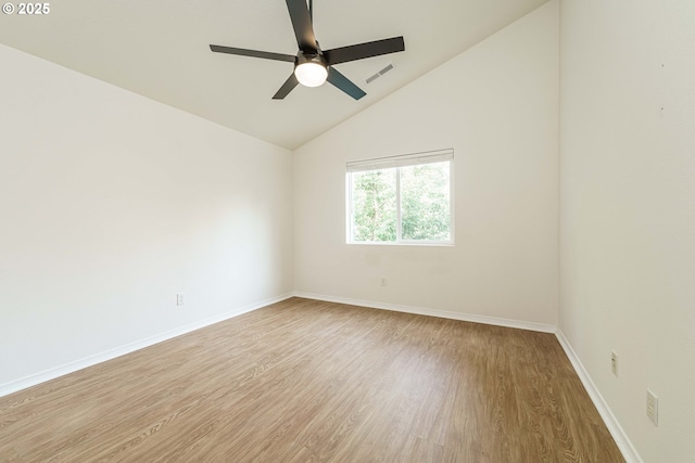 unfurnished room featuring ceiling fan, lofted ceiling, and light hardwood / wood-style flooring