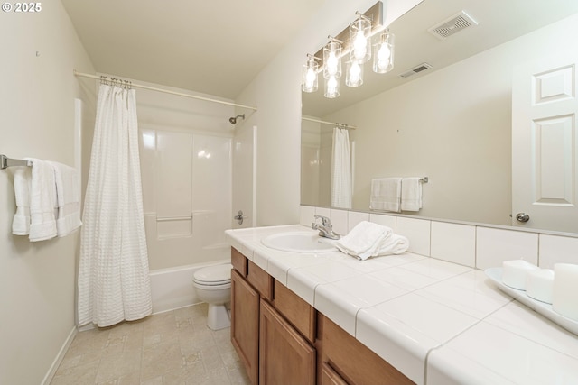 full bathroom with vanity, shower / bath combination with curtain, and toilet