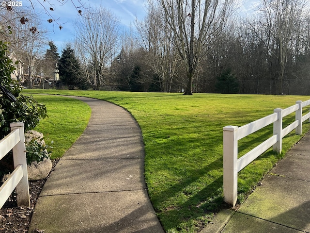 view of home's community featuring a lawn