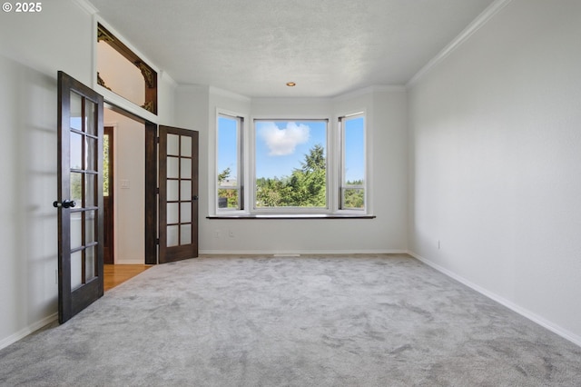 6765 SW 153rd Ave, Beaverton, OR 97007 - unfurnished room featuring carpet flooring, french doors, crown molding, and baseboards