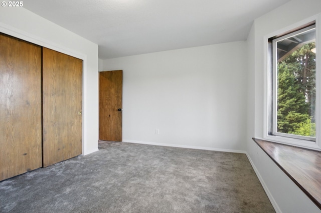 6765 SW 153rd Ave, Beaverton, OR 97007 - unfurnished bedroom featuring carpet floors, a closet, and baseboards