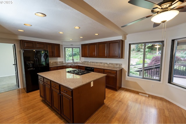 6765 SW 153rd Ave, Beaverton, OR 97007 - basement with track lighting, stairway, hardwood / wood-style flooring, and baseboards