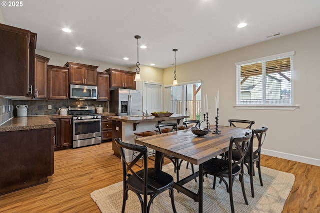 dining space featuring light hardwood / wood-style flooring